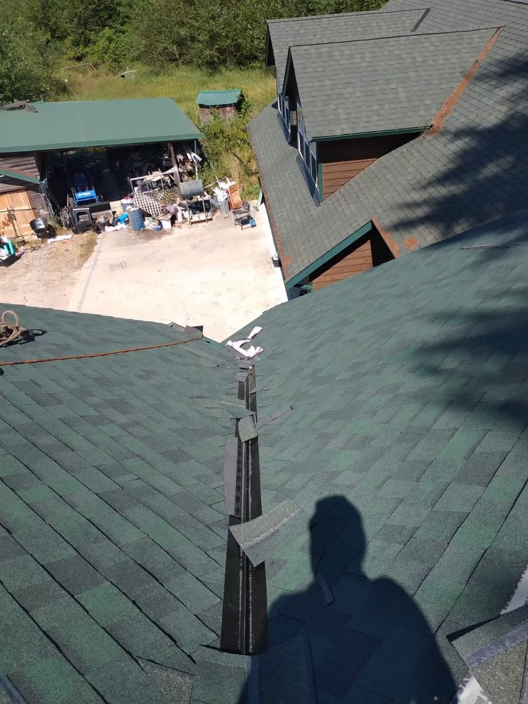 Green shingle roof ridge installation - Seattle