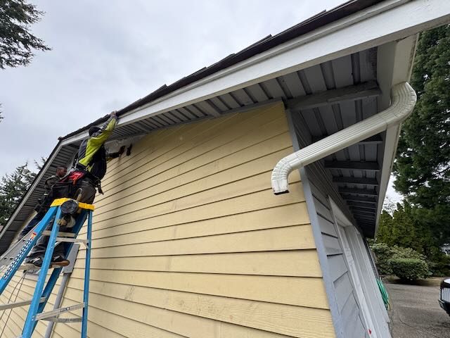 Roof4Life crew installing siding